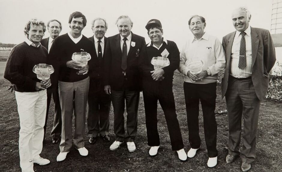 Black and white group photograph of professional golfers Bernhard Langer, Seve Ballesteros, Lee Trevino, and Christy O'Connor Senior alongside golf club officials at Golf Club of Dublin, with several players holding crystal glass trophy bowls